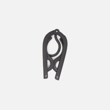 The Fridja f10 Portable Folding Hanger, made from black plastic and metal with curved, scissor-like blades, is shown closed against a plain white background—ideal as a travel garment support or accessory.