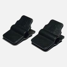 Two Fridja f1000 Clips (x2), black with wide, flat mouths and ridged grips, are shown side by side on a plain white background. Perfect replacement clips for your Vertical Clothes Steamer.