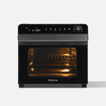 A Fridja Super Oven Pro - 30L Digital Air Fryer Oven with a black finish, digital display, multiple buttons, and a top dial. The oven door is shut, the interior light is on, and the brand name Fridja appears at the bottom.