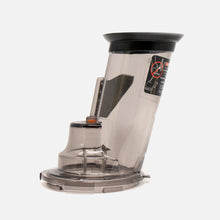 The Fridja f1900 Tilting Lid, a transparent plastic juicer or food processor chute attachment with black and orange accents and an integrated blade, is displayed against a plain white background.