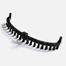 The Fridja f1000 Upholstery Brush is a curved black plastic brush with short, stiff bristles and two cylindrical mounting ends—an ideal replacement for effective fabric care, shown against a plain light background.