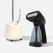 The Fridja Steamer Duo—f10 and f1200—features a white upright clothes steamer with hose and pole, plus a compact black handheld steamer with transparent tank, perfect for wrinkle-free garments.