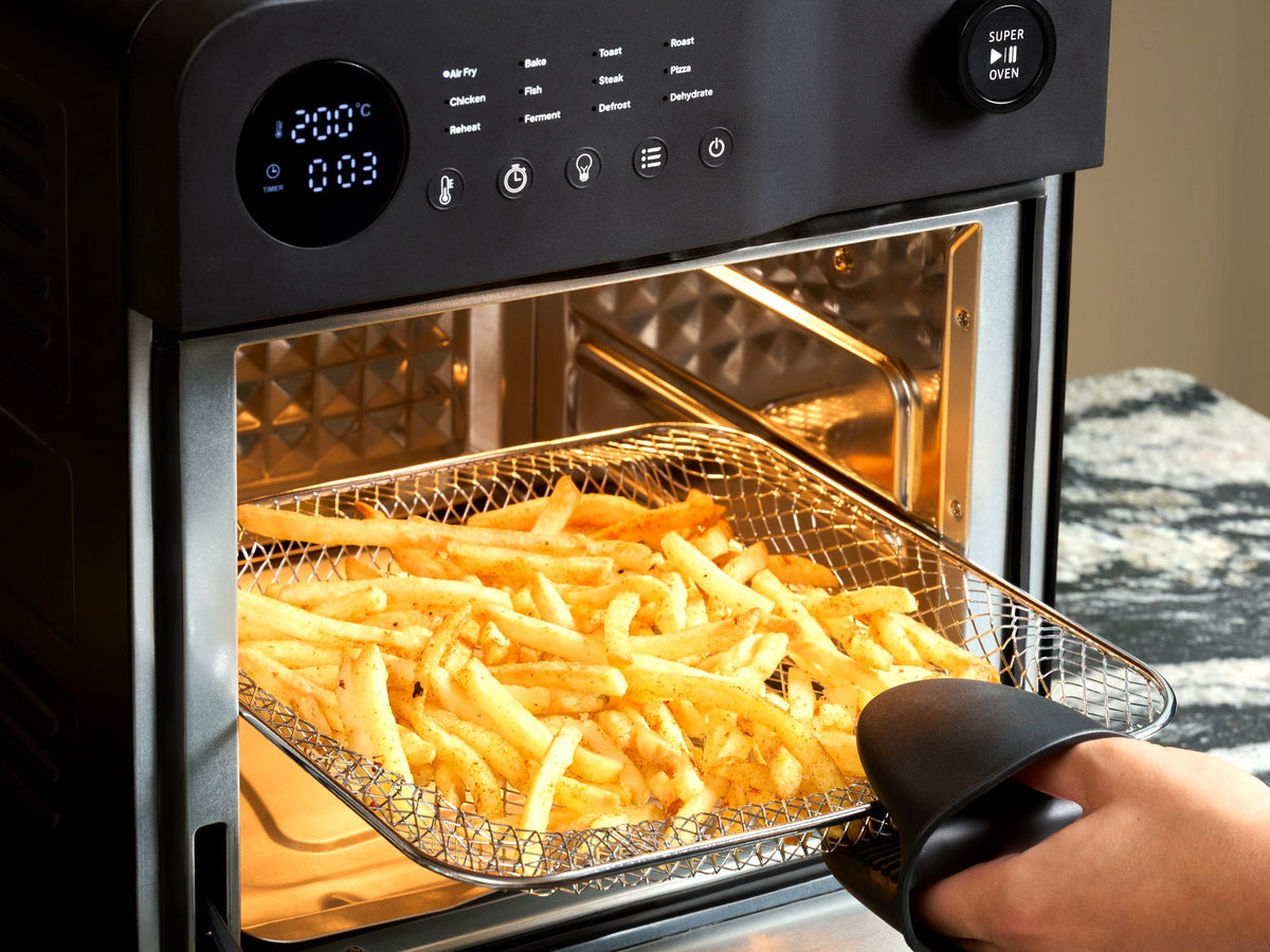 Homemade chips in the air fry basket of the Fridja f66 Super Oven air fryer oven