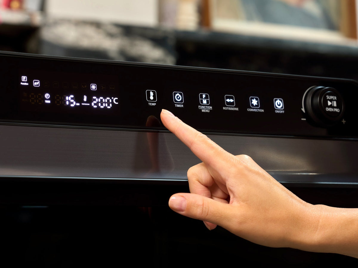 Setting the temperature on the Fridja f77 Super Oven Pro air fryer oven before cooking a turkey crown