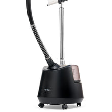 A Fridja f1200 steamer in black with a transparent f1200 Water Tank with cap, mounted on wheels, featuring a flexible hose and adjustable chrome pole.