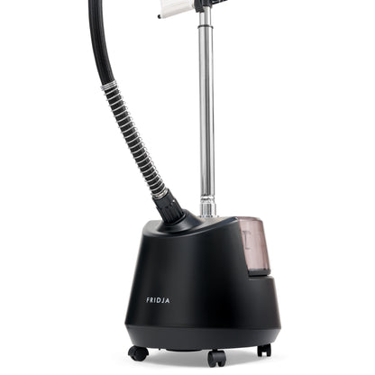 A Fridja f1200 steamer in black with a transparent f1200 Water Tank with cap, mounted on wheels, featuring a flexible hose and adjustable chrome pole.