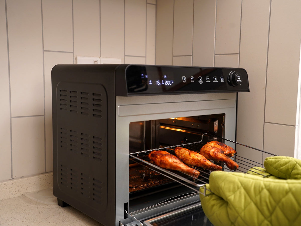 Crispy chicken drumsticks on the rack of the Fridja f77 Super Oven Pro 30L air fryer oven