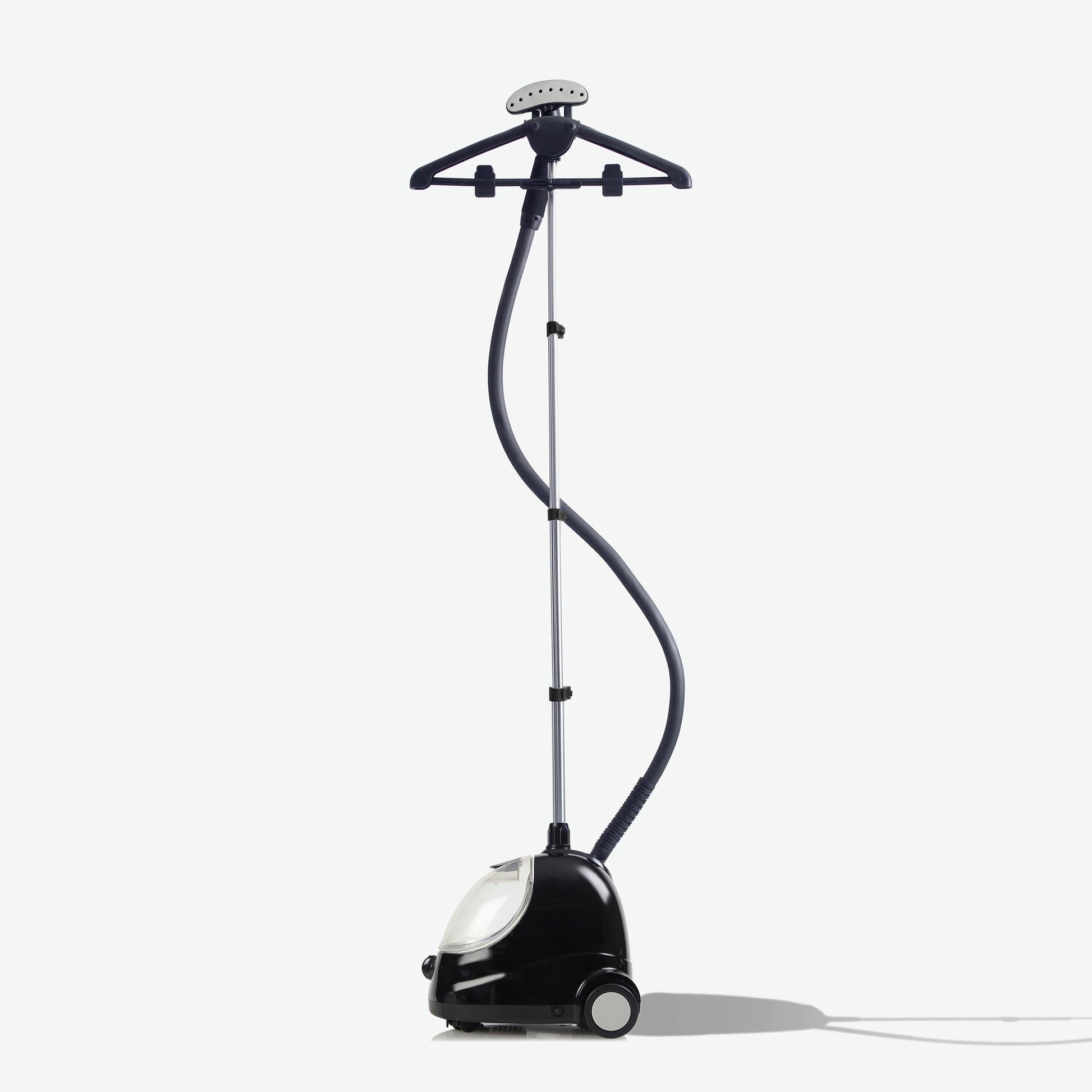 The Fridja f1000 Clothes Steamer - Refurbished Grade B is a black and silver steamer with wheels, an upright pole, flexible hose, and hanger attachment—ideal for refreshing fabrics. Set against a plain white background.