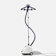 The Fridja f1000 Clothes Steamer - Refurbished Grade B features a black hose, adjustable pole, and hanger attachment, standing upright on wheels against a white background—ideal for easily removing creases.