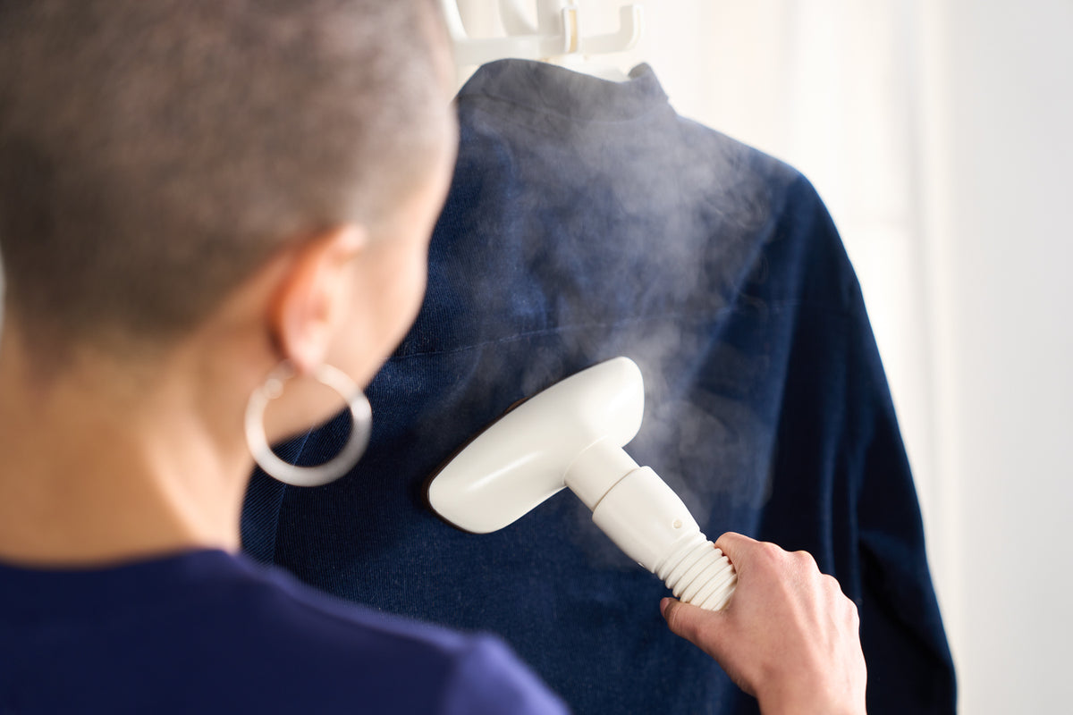 Powerful steam from the Fridja f1200 removing creases from a navy jacket