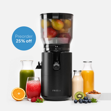 Fridja f2800 Open Whole Fruit Juicer with self-feeding hopper and fruit-filled top container, surrounded by bottles of vibrant juices, fresh fruits, and almonds. A blue circle reads: "Preorder 25% off.