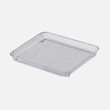 The Fridja f77 Air Fryer Basket is a rectangular, shallow silver metal mesh accessory with raised edges, designed for use with the f77 Super Oven or air fryer. The basket is shown on a white background.