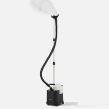 The Fridja f1600 Commercial Clothes Steamer features a long flexible hose, steam nozzle, and a rectangular wheeled base with water tank, all set against a plain white background.