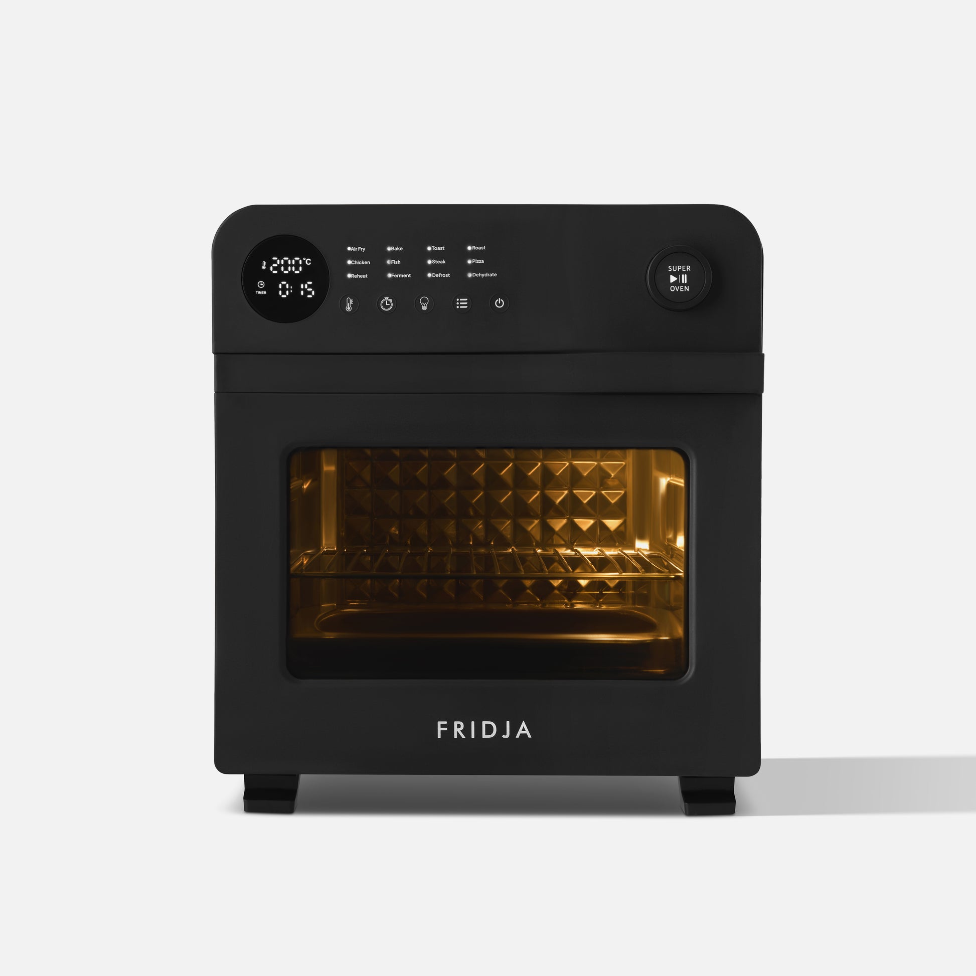 The Fridja f66 Super Oven is a black countertop oven with a digital display, control buttons, and a knob. It features an illuminated interior and textured oven wall visible through its glass door.