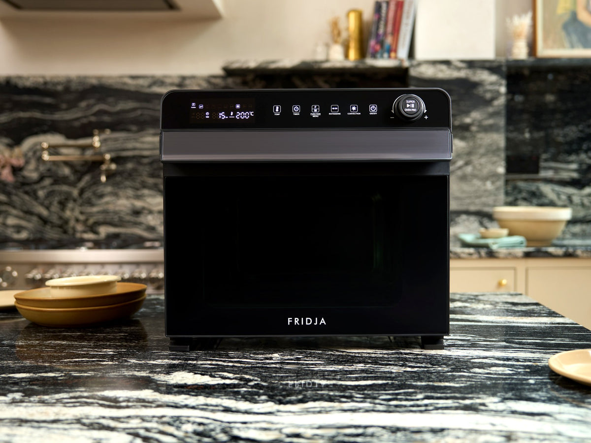 Fridja f77 Super Oven Pro air fryer oven, clean and ready to use on a marble kitchen worktop