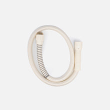 The Fridja f1200 Hose is a coiled, light beige flexible replacement steam hose with ribbed connectors (one reinforced by a metal spring) for the f1200 Clothes Steamer Pro, shown on a plain white background.