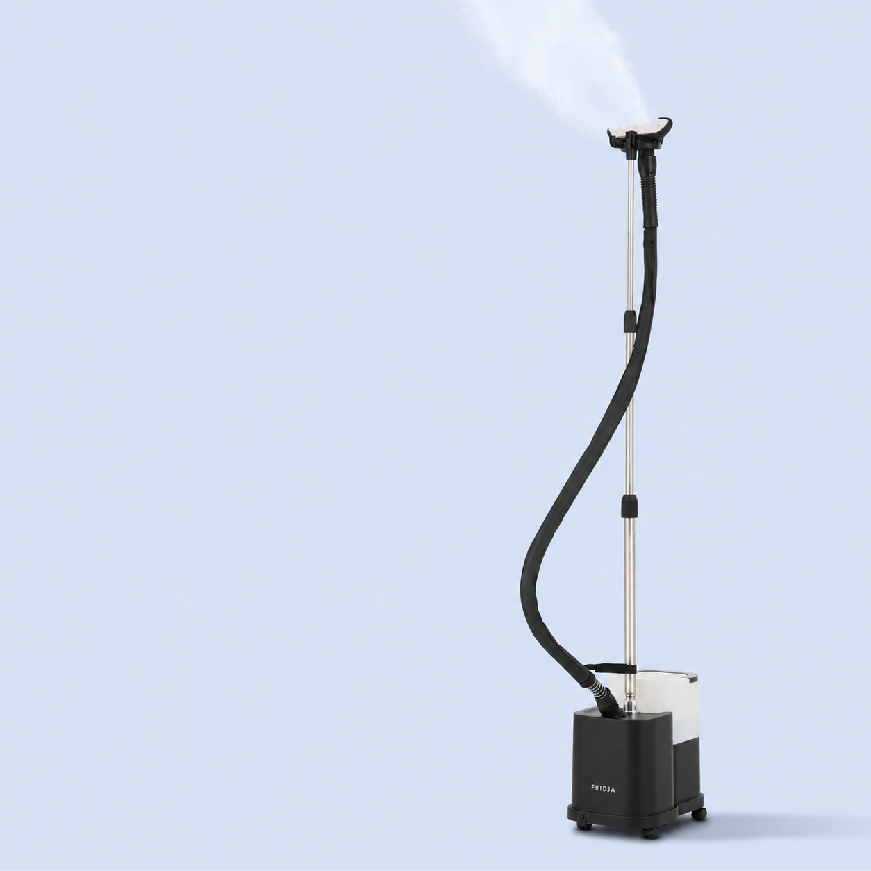 A standing garment steamer with a black hose and nozzle emits steam against a plain light blue background. The base is rectangular and black, with a transparent water tank.