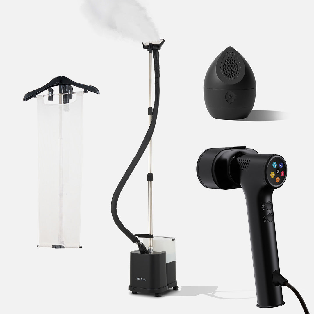 Four innovative Fridja garment care products are displayed on a white background: the f1600 Commercial Clothes Steamer billowing visible steam, a Flexible Ironing Board, the f20 Handheld Clothes Steamer Pro, and the compact black f40 Fabric Shaver.