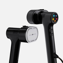 Two Fridja f20 Handheld Clothes Steamer Pros with Suction in black—one positioned to reveal its vented plate, the other highlighting a vibrant button panel and side controls—are displayed against a plain light background, offering a versatile and reliable portable steaming solution.