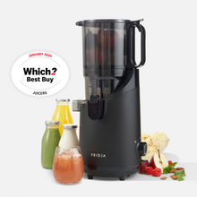 The refurbished Fridja f2500 Self Feeding Whole Fruit Juicer in black stands beside bottles, a glass of cold-pressed juice, fresh fruit, and a Which? Best Buy Juicers January 2025 award badge on a light background.
