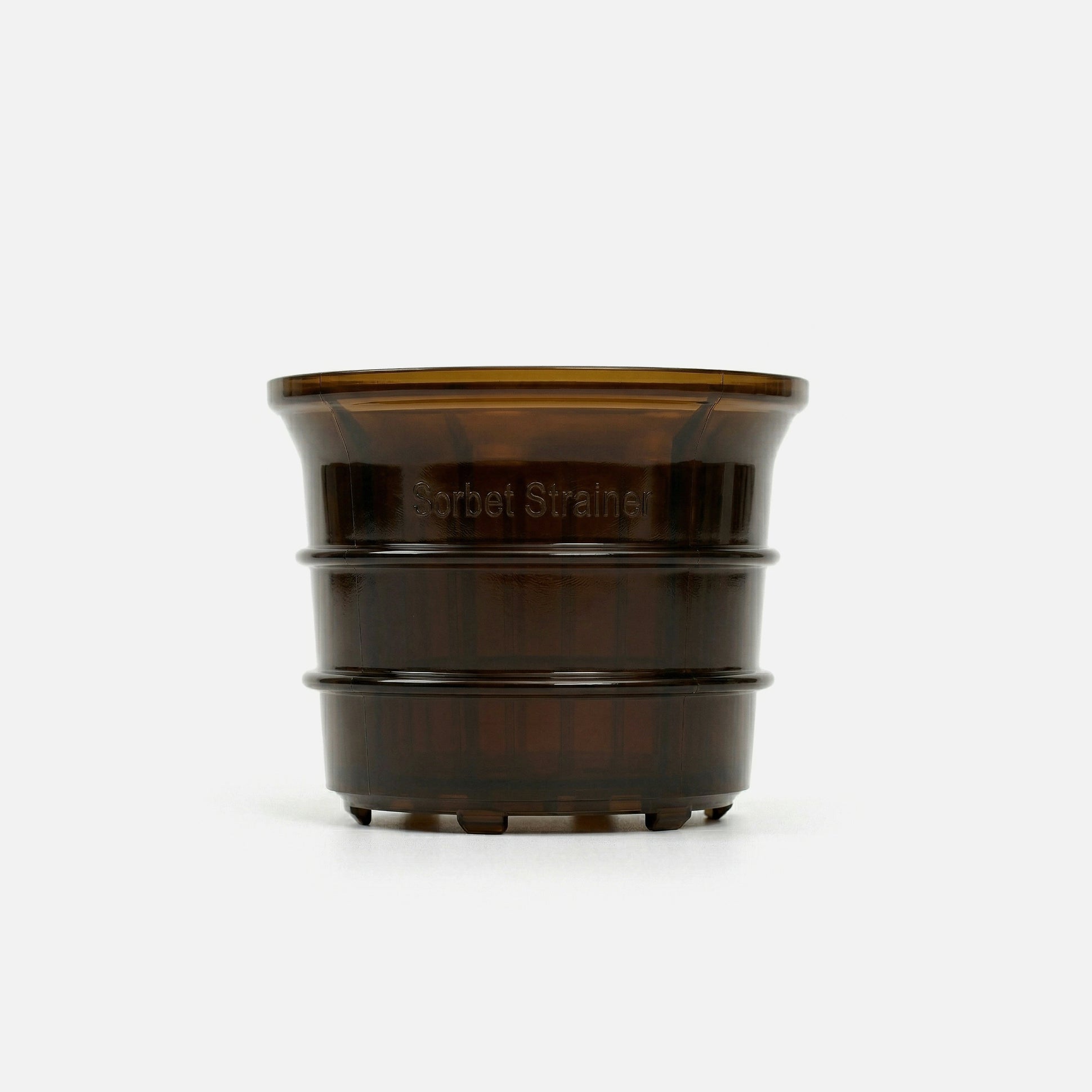 A brown, translucent plastic cup-shaped object with ridges and the words Sorbet Strainer embossed on the side, shown against a plain white background.