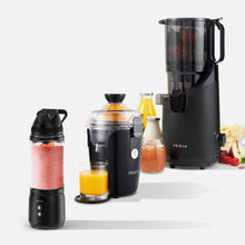Three black Fridja kitchen appliances—Kitchen Trio f500, f800, and f2500—are displayed with juice-filled glasses and fresh fruits on a white background.