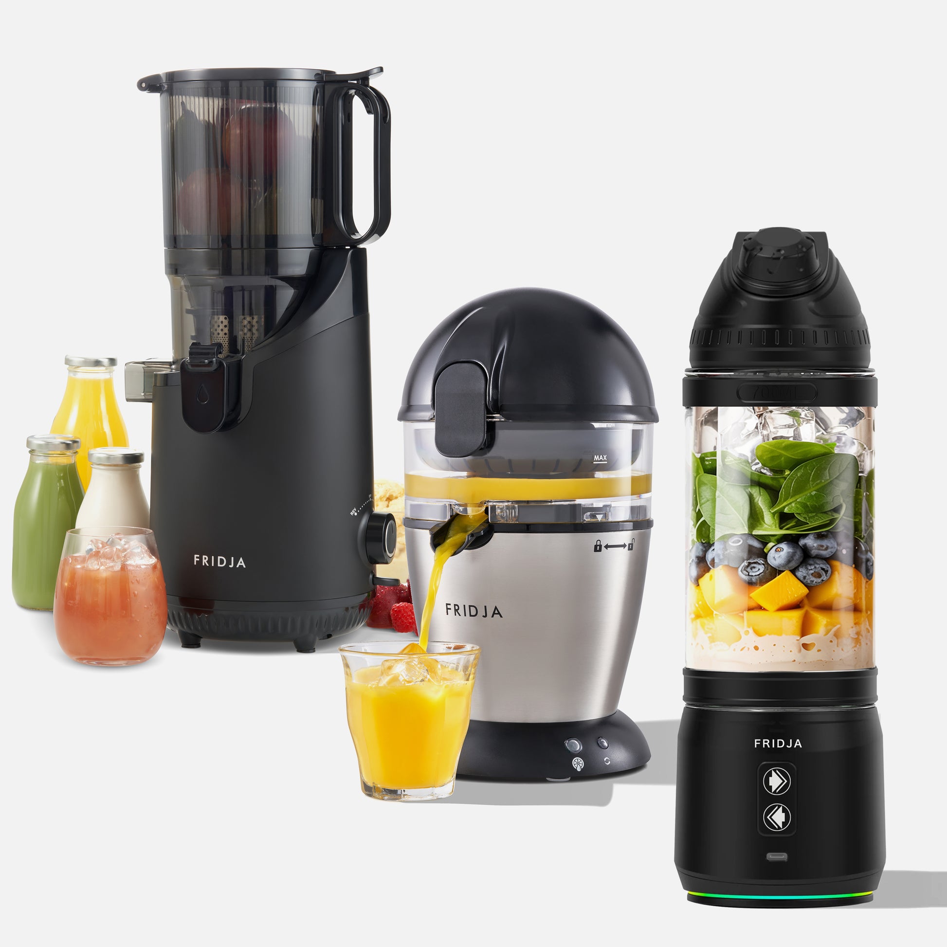 Fridja's Kitchen Pro Trio—f500 Portable Blender, f900 Citrus Juicer, and f2500 Self-Feeding Juicer—are shown with fresh juices, fruits, and bottles on a white background.