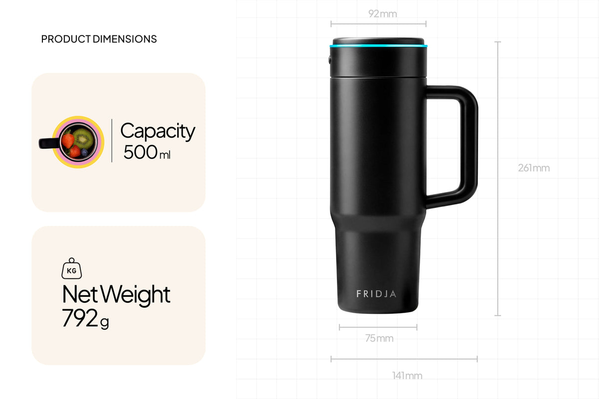 A black travel mug with a handle, branded Fridja, is displayed on a grid background with dimensions, 500 ml capacity, and 792 g net weight—ideal for carrying your cold press smoothies or juices made using the Juicer Duo – f2500 Self Feeding Whole Fruit Juicer & f600 Stainless Steel Portable Blender. Close-up illustrations emphasize the mug’s capacity and weight.