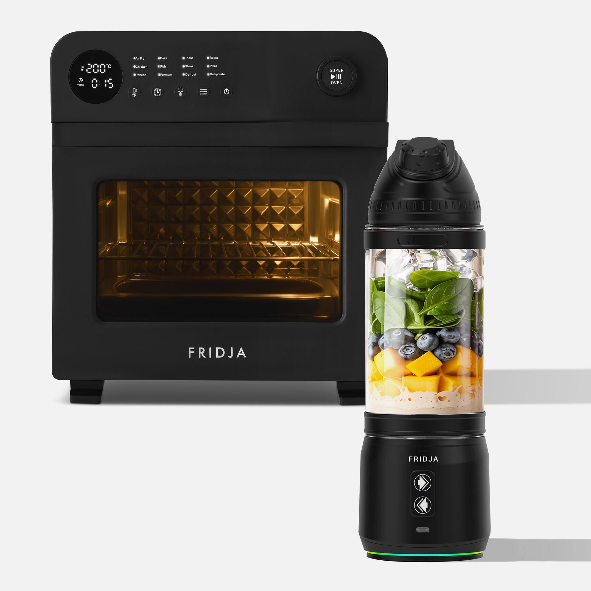 The Fridja Super Kitchen Duo—featuring the f66 Super Oven (black, digital display) and the f500 Portable Blender (filled with spinach, blueberries, mango, and ice)—are displayed together.