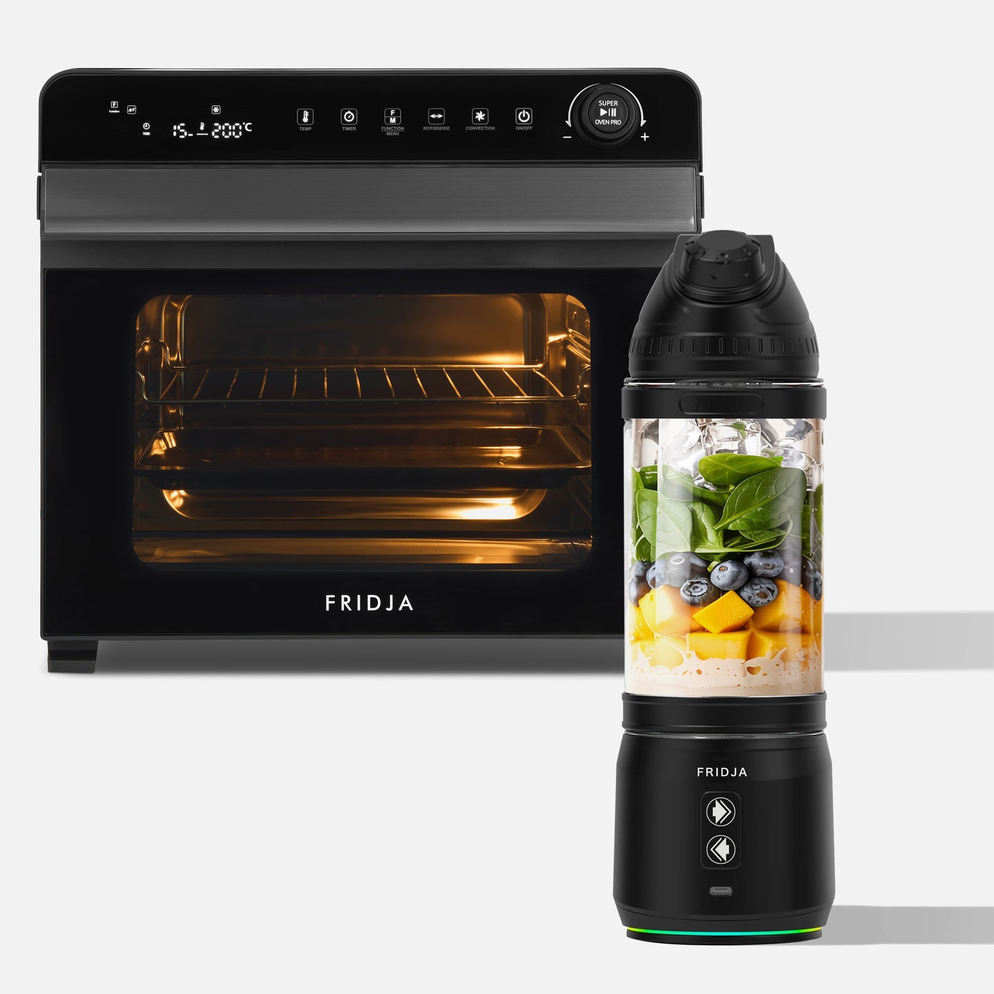 A Fridja Super Kitchen Pro Duo, featuring the f77 Super Oven Pro (open with light on) and the f500 Portable Blender filled with milk, mango, spinach, and blueberries, is displayed against a white background.