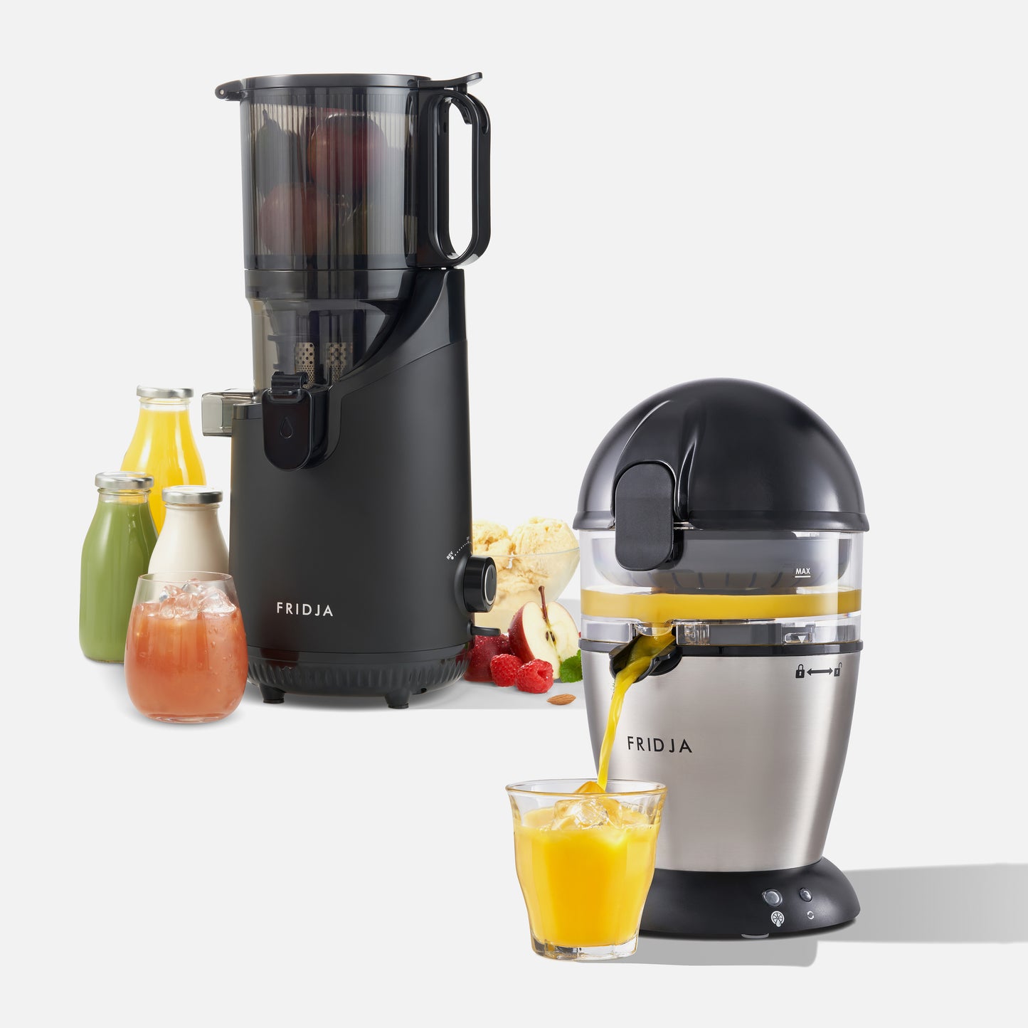 Fridja's Juicer Duo—900 Automatic Citrus Juicer (silver dome) & f2500 Self-Feeding Juicer (black vertical)—are shown with colorful juice bottles, glasses, and fresh fruits against a white background.